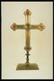 Хрест з металу під колір золота з червоними камінням