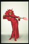 Диявол. Жінка в червоному костюмі з вилами в руках
